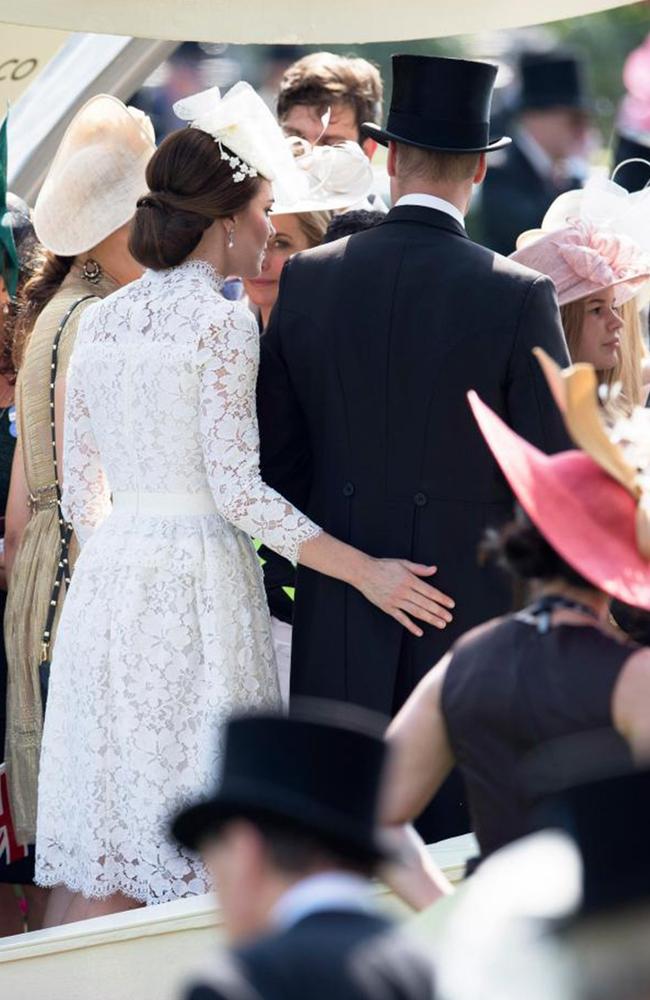 Kate gives husband William a right royal bum-pat. Picture: The Sun