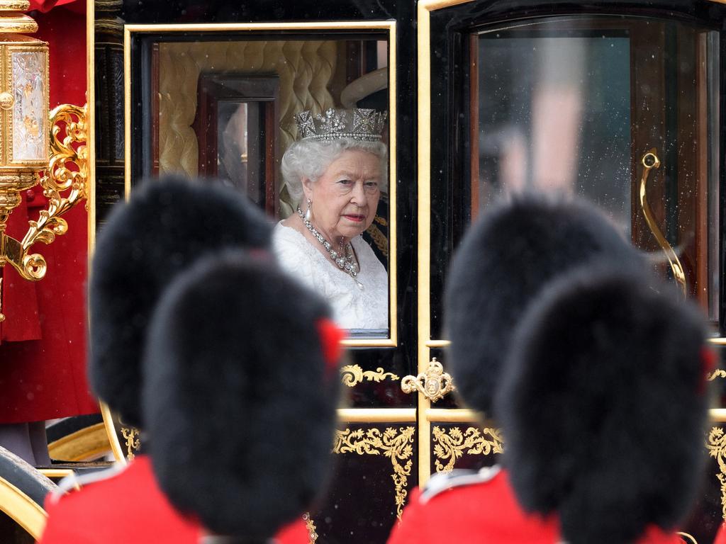 Queen Elizabeth II travels towards the Houses of Parliament in the Jubilee State Carriage as she prepares to address the State Opening of Parliament on May 18, 2016. Picture: AFP