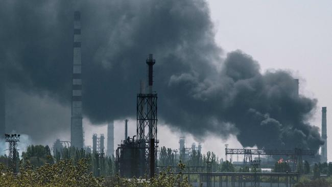 A smoke after shelling rises from an oil refinery near Lysychansk, eastern Ukraine, on May 9, on the 75th day of the Russian invasion of Ukraine. Picture: Yasuyoshi Chiba / AFP