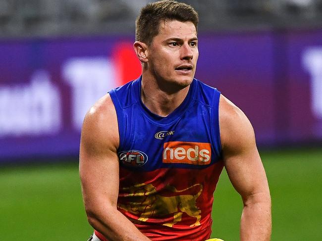 PERTH, AUSTRALIA - AUGUST 08: Dayne Zorko of the Lions runs with the ball during the 2021 AFL Round 21 match between the Fremantle Dockers and the Brisbane Lions at Optus Stadium on August 8, 2021 in Perth, Australia. (Photo by Daniel Carson/AFL Photos via Getty Images)