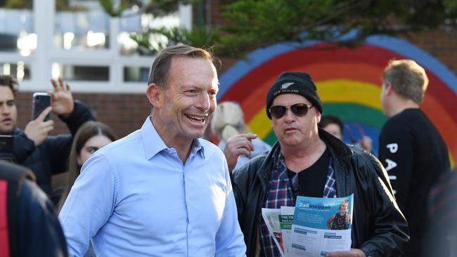 Former prime minister and member for Warringah Tony Abbott takes his place in the quest as he waits to vote at Forestville Public School on Election Day in Sydney, Saturday, May 18, 2019. Approximately 16.5 million Australians will vote in what is tipped to be a tight election contest between Australian Prime Minister Scott Morrison and Australian Opposition leader Bill Shorten. (AAP Image/Dean Lewins) NO ARCHIVING