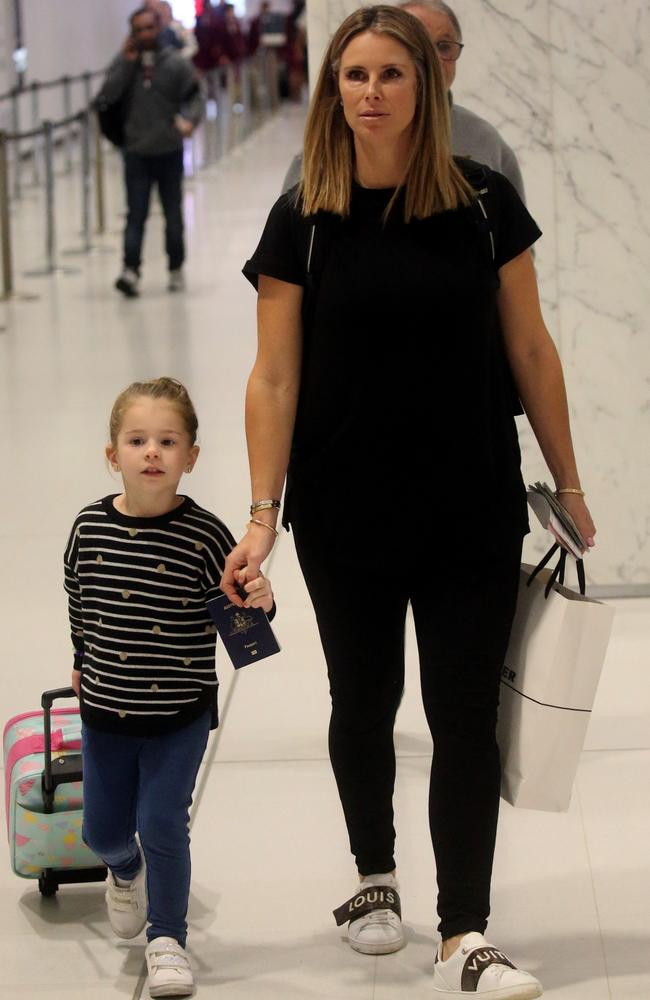 Candice Warner, pictured with her daughter Ivy, leaving Sydney bound for London. Picture: Diimex