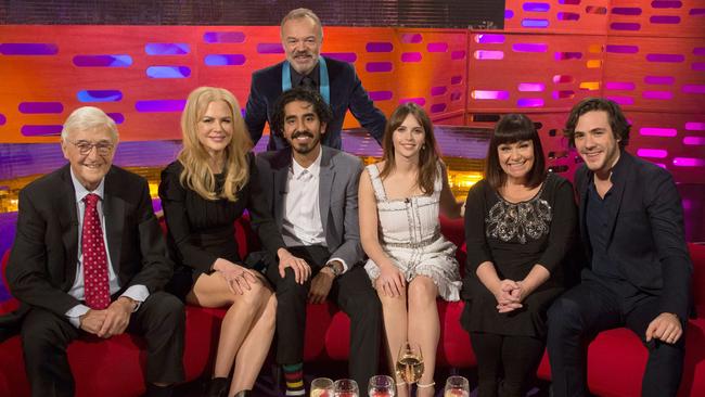 Graham Norton (back) with his guests for The Graham Norton Show (from left) Sir Michael Parkinson, Nicole Kidman, Dev Patel, Felicity Jones, Dawn French and Jack Savoretti. Picture: Channel 10