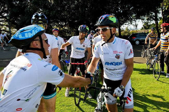 <p>Tony Abbott shakes hands with a fellow cyclist after finishing the 2010 Pollie Pedal. Picture: Amos Aikman</p>