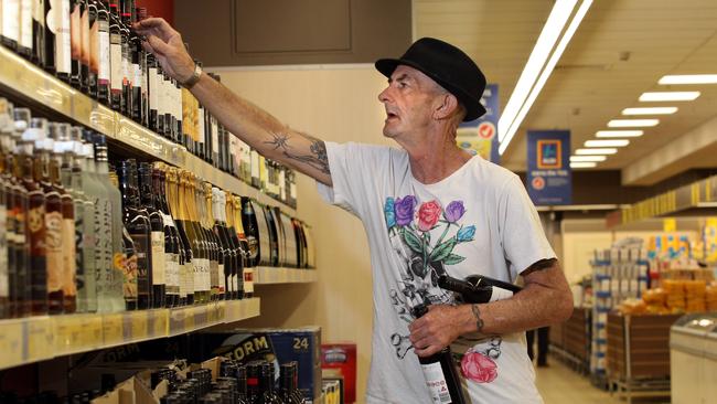 Top shelf ...  Peter Ryan from Port Melbourne buying some red wine at the Aldi store in South Melbourne.
