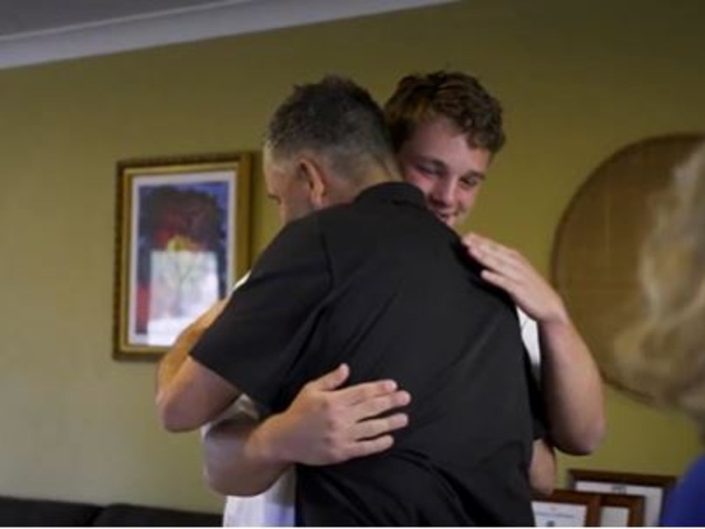 A hug from his new coach.