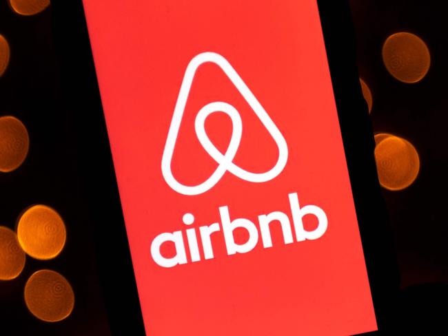 (FILES) This file illustration photo taken on November 22, 2019 shows the logo of the online lodging service Airbnb displayed on a tablet in Paris. - Airbnb and DoorDash make their stock market debut this week as part of a "unicorn parade" capping a busy year for hot startups going public. The startups known as unicorns -- valued in the billions -- are poised to take advantage of a market hungry for young businesses promising fast growth, with some taking advantage of lifestyle changes due to the pandemic. (Photo by Lionel BONAVENTURE / AFP)