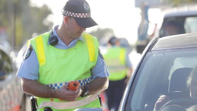 The man allegedly drove drunk and used his mobile phone through a school zone in Annandale on Tuesday.