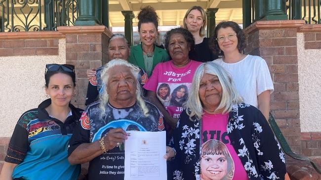 Dawn and June Smith, front, with their family outside the Bourke courthouse on Tuesday.