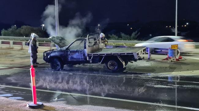 Fireys extinguish burning ute on Townsville Ring Road. Picture: Tidy Towing