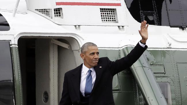 Former President Barack Obama waves as he boards a Marine helicopter during a departure ceremony. Picture: AP