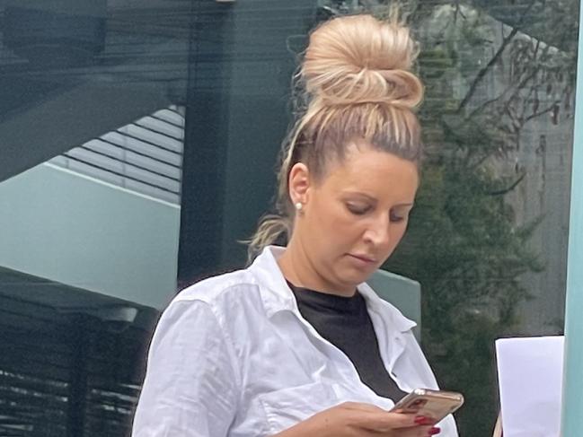 Hairdresser Carly Love leaving Gosford District Court where she had her community service hours reduced after pleading guilty to defrauding Covid Jobsaver payments. Picture: NewsLocal