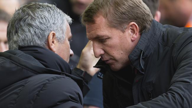 Liverpool's manager Brendan Rodgers, right, greets Chelsea's manager Jose Mourinho.