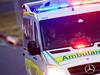 Vehicle on its roof after rollover on busy road
