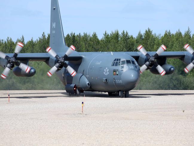 A Hercules plane from the Royal Canadian Air Force joins the search. Picture: Clint Brewer/ News Corp Australia