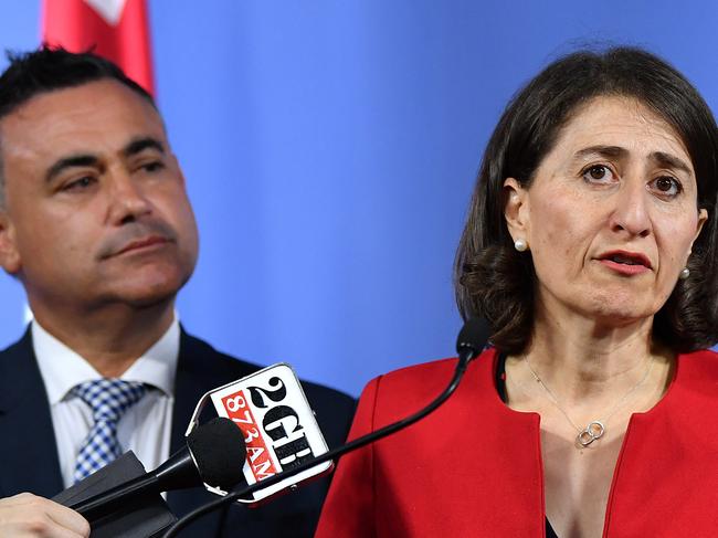 (L-R) NSW Deputy Premier John Barilaro, NSW Premier Gladys Berejiklian, and NSW Treasurer Dominic Perrottet speak to the media in Sydney, Friday, March 2, 2018. (AAP Image/Joel Carrett)  NO ARCHIVING