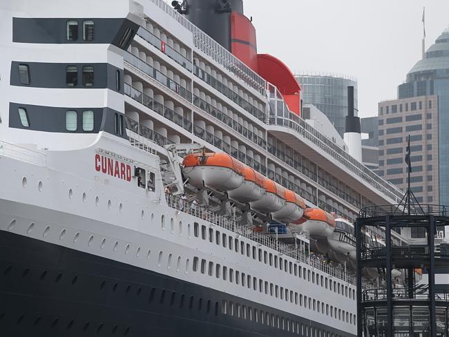 Passengers on the massive Queen Mary 2 check out Sydney from the safety, and vantage point, of the newly docked ship. Picture: Bill Hearne