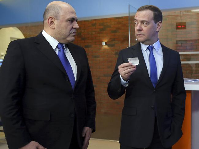 Russian Tax Service chief Mikhail Mishustin, left, will replace Russian Prime Minister Dmitry Medvedev.