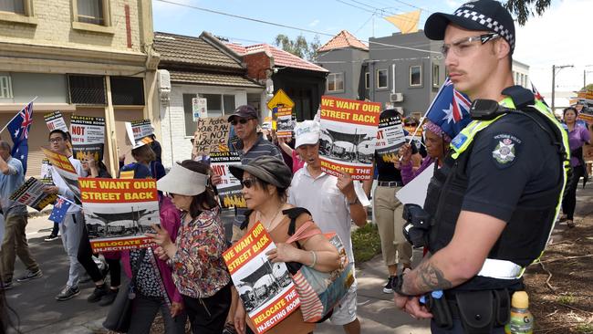 Police watch on at the peaceful protest in Richmond. Picture: Tony Gough