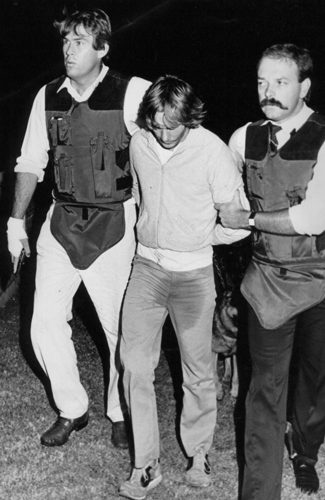 Gary Murphy wets his pants as he is arrested after trying to flee his hide-out with brother Michael, the final two to be captured for killing nurse Anita Cobby in 1986.