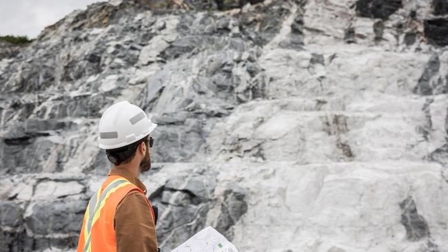 Sayona worker in front of a lithium deposit in central Quebec. Photo: Mathieu Dupuis