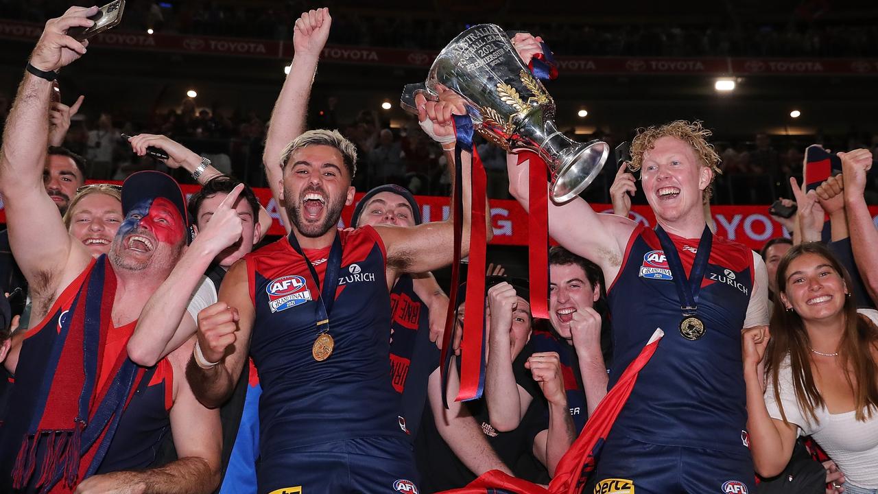 Christian Salem and Clayton Oliver celebrate with the premiership cup. Picture: Getty Images