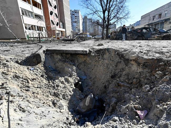 Picture shows a crater caused by recent shelling in Kyiv. The UN human rights chief said that at least 102 civilians, including children, had been killed in Ukraine since Russia launched its invasion five days ago. Picture; AFP