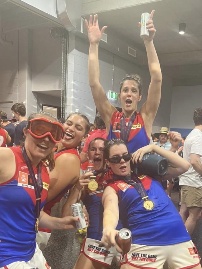 Melbourne Demons players celebrate their AFLW grand final win