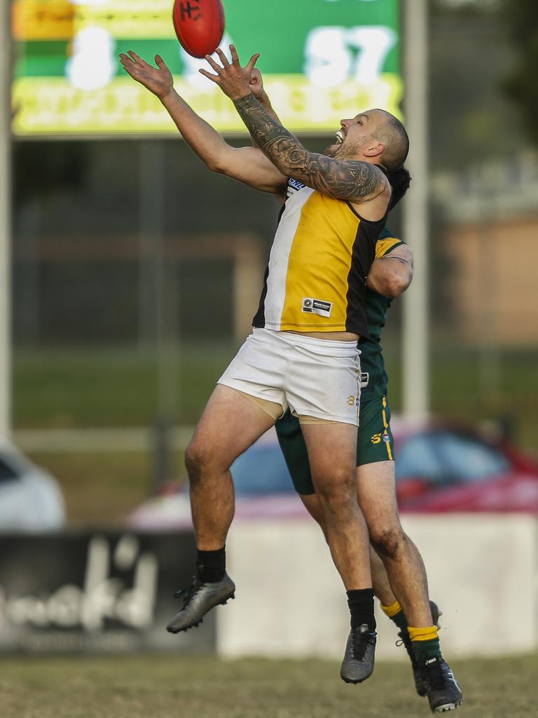 Southern: Ashwood’s Jack Purcell flies for a mark against Endeavour Hills. Picture: Valeriu Campan