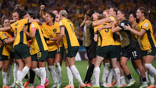 Australian players celebrate at the end of the shootout