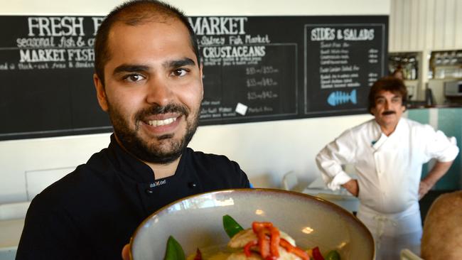 Owners Anil Dua and his son Ujwal at their cafe in Manly. Picture: AAP Image/ Jeremy Piper