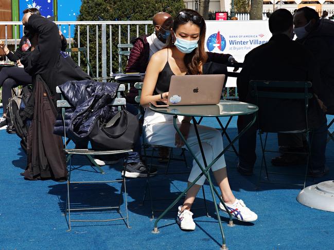 A masked woman in Bryant Park, New York City. Picture: Getty Images