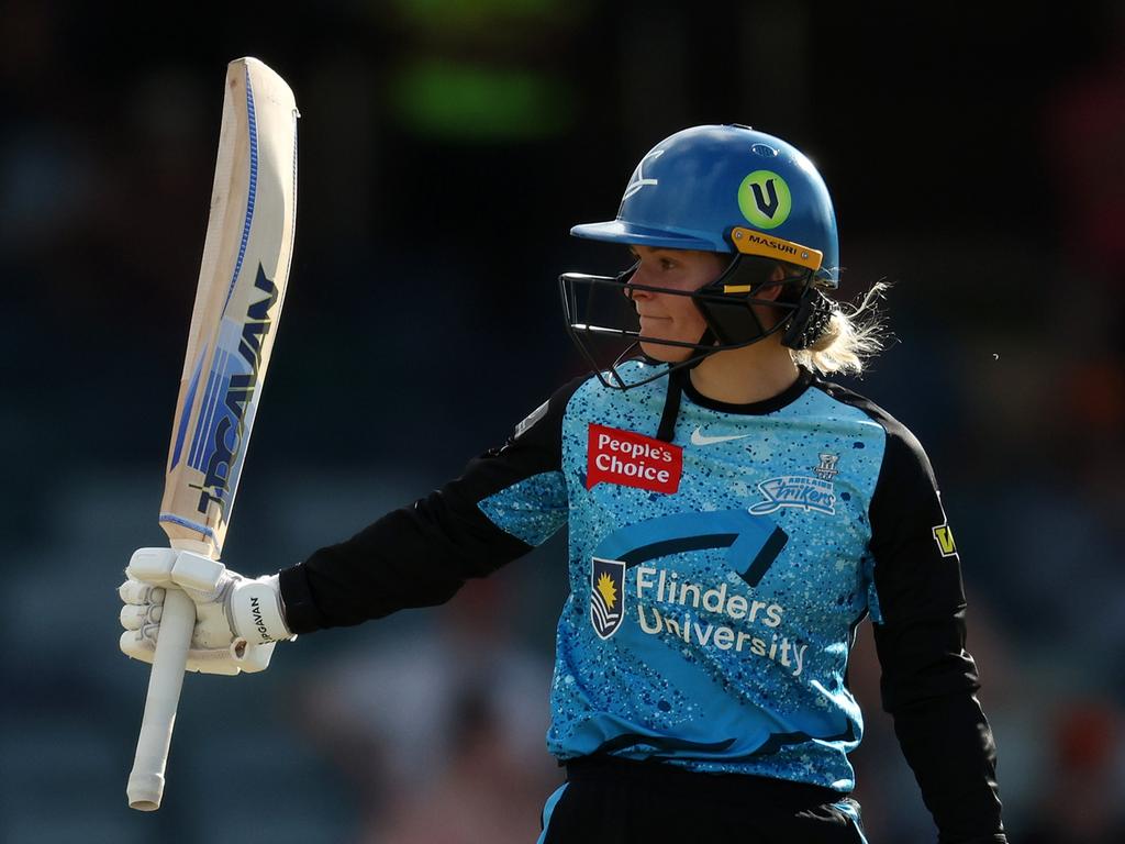 Mack raises her bat after another milestone. Picture: Will Russell/Getty Images