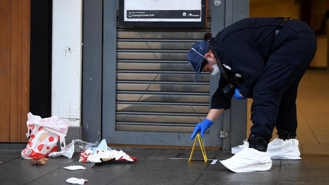 NSW Police establish a crime scene on Darlinghurst Road at Potts Point in Sydney on May 4 after a 19-year-old man was found in Potts Point with a stab wound to the neck. Picture: AAP Image/Joel Carrett