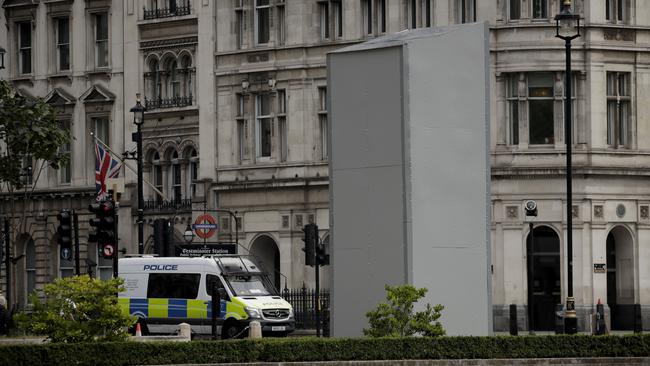 A protective screen put up around the Churchill statue. Picture: AP