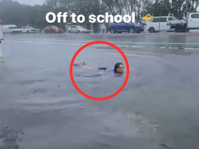 One video showed a child swimming in the flood water near a bus stop.