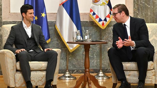 Serbian tennis player Novak Djokovic (L) meets Serbian President Aleksandar Vucic in Belgrade on February 3, 2022. - The 34-year-old world number one was unable to play in the Australian Open after being deported over Covid-19 vaccination issues, despite initially receiving an exemption from officials based on an positive PCR test weeks ahead of the tournament. (Photo by Andrej ISAKOVIC / AFP)