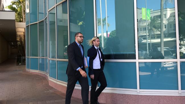 Shane Cuthbert (right) leaves the Cairns courthouse with his lawyer Richard Whitla after pleading guilty to trying to board a Jetstar flight with a ticket labelled Kermit the Frog. Picture: Supplied