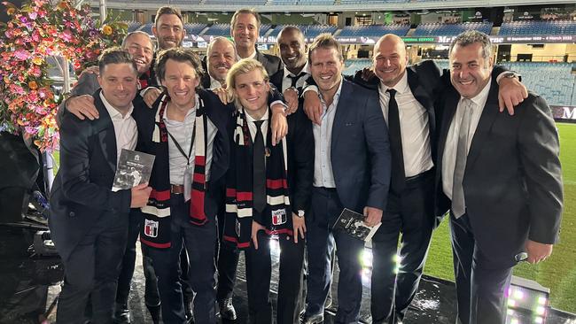 Jackson Warne with his dad’s mates on the MCG ahead of the state memorial.