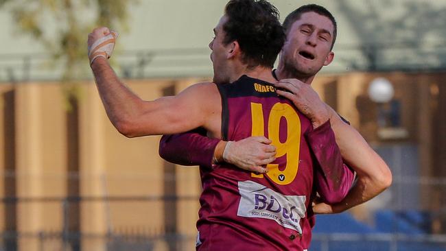 Top cricket official goes into bat for local footy