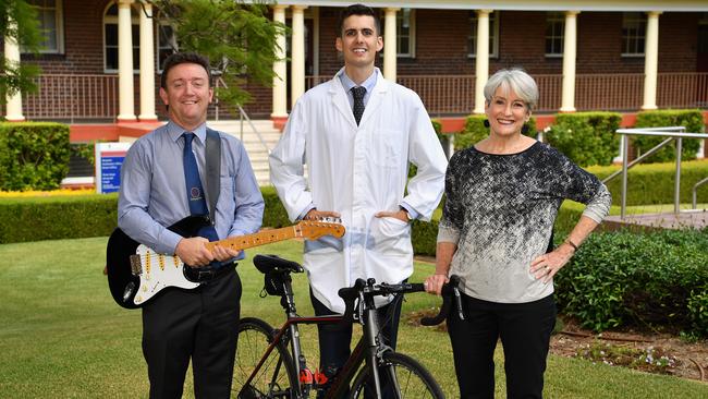 (L-R) Music teacher Brad Merrick, Science teacher Matt Hill and Robyn Leonard pose for a photo Barker College in Hornsby, Sydney, Wednesday, Feb. 7, 2018. (AAP Image/Joel Carrett)