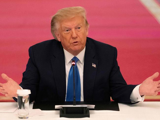 US President Donald Trump participates in a roundtable with stakeholders positively impacted by law enforcement, in the East Room of the White House in Washington, DC, on July 13, 2020. (Photo by JIM WATSON / AFP)