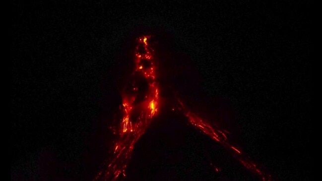 Philippines' Mayon volcano lights up the night