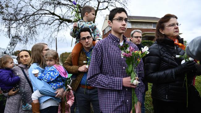 People arrive to pay their respects in front of a memorial outside the Tree of Life synagogue. Picture: AFP