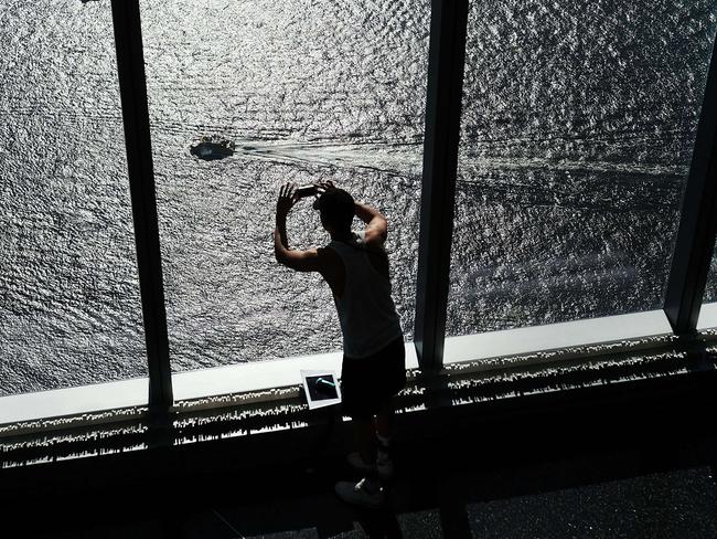 A man takes a photo of the Hudson River from the new One World Observatory at One World Trade Center. Picture: Spencer Platt/Getty Images/AFP