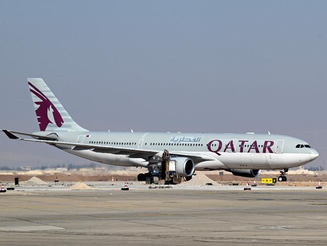 A Qatar airways flight lands at the Damascus International Airport on January 7, 2025. Syria's main airport in Damascus will resume international flights starting January 7 after such commercial trips were halted following last month's ousting of president Bashar al-Assad. (Photo by LOUAI BESHARA / AFP)