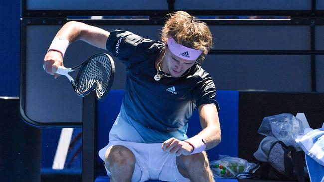 Germany's Alexander Zverev smashes his racquet 