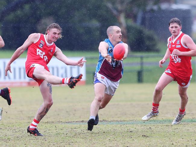 Modewarre's Lindsay Phillips (29) does his best to smother Craig Goodger's (48) clearance. BFL: Ocean Grove v Modewarre senior football. Picture: Alan Barber