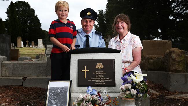 Austin Stevens, 6, with father Tim Stevens, who is an Airforce member, and grandmother Gail Jarvis, all of Hobart. They are at the grave of Private Richard Patterson, who is Gail's grandfather. Picture: NIKKI DAVIS-JONES