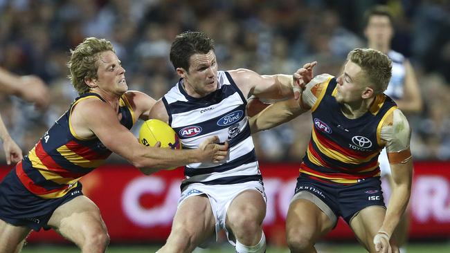 Crows midfielders and Hugh Greenwood gang tackle Geelong star Patrick Dangerfield. Picture: Sarah Reed